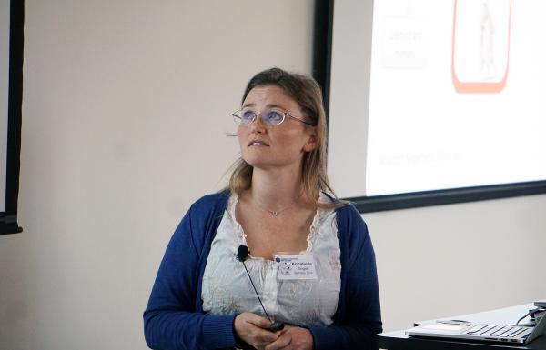 Annabelle Singer discussed her research with a room full of researchers at the I2B Workshop.