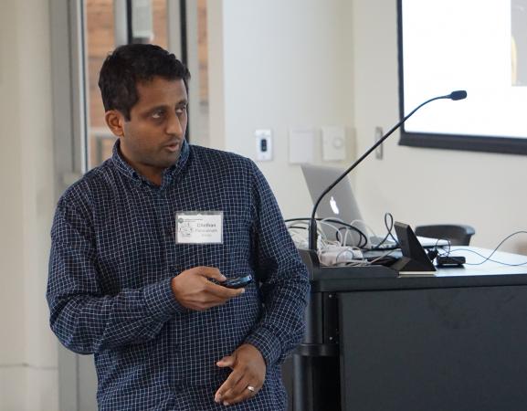 Chethan Pandarinath presents his research at the workshop.