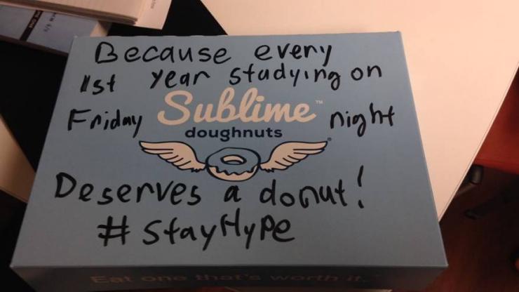 A Sublime Doughnuts box with a message written in black marker: "Because every 1st year studying on Friday night deserves a donut! #StayHype"