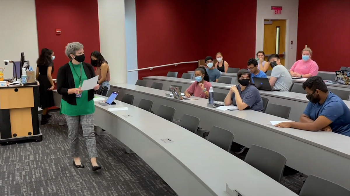 Cristi Bell-Huff teaching in a classroom.