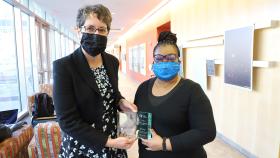 Kim Paige, right, accepts a Georgia Tech College of Engineering 2021 Culture Champion Award from Coulter Department Chair Machelle Pardue. (Photo: Joshua Stewart)