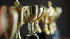 A line of gold trophies. (Photo: iStock)