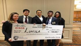 Robert Mannino and Prateek Mittal holding their $100,000 Cisco check. 