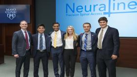Team Neuraline and Dr. Rains: Pictured are (left to right), Professor of the Practice James Rains, and Capstone students Cassidy Wang, Dev Mandavia, Marci Medford, Lucas Muller, and Alex Bills. They visited the Mayo Clinic in Jacksonville, Florida, to make their Capstone presentation.