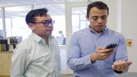 Graduate student Rob Mannino (right), pictured with Wilbur Lam (left) was able to refine and tweak technology for anemia detection by using himself as a test subject. Photo by Christopher Moore, Georgia Tech.