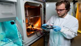 Riley Zeller-Townson, a Georgia Tech Ph.D. student in Steve Potter’s lab, demonstrates preparation of a cell culture for placement into the optoclamp. The optoclamp uses a computer to acquire and process the neuronal response to optical stimuli in real-time and then vary the light input to maintain a desired firing rate. (Credit: Rob Felt, Georgia Tech)