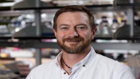 Tom Barker, an associate professor in the Wallace H. Coulter Department of Biomedical Engineering at Georgia Tech and Emory University, is shown in his laboratory in Georgia Tech’s Engineered Biosystems Building. Barker has received a $3.5 million, five-year grant to support research into new approaches for tracking and treating pulmonary fibrosis. (Credit: Rob Felt, Georgia Tech)