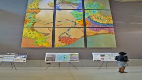 A Petit Scholar enjoys the calm in the atrium before a recent poster session.