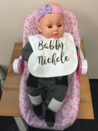 "Babby Michele," a kicking baby doll used in Fry's research to simulate infant kicking motion. Fry uses Babby to test sensor suit designs and to collect synthetic data before she tests her work on human babies.