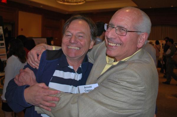 Chris Evans of the Mayo Clinic (left) and Arnie Caplan of Case Western University were formidible "foes" in the annual workshop debate.