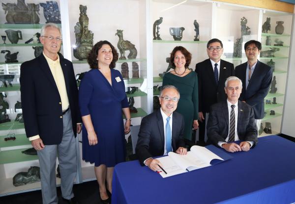 Susan Margulies, BME chair (middle, green dress), at the Nakatani agreement signing. She is surrounded by representatives from the Nakatani Foundation, Japanese Consulate, and representatives from Georgia Tech.