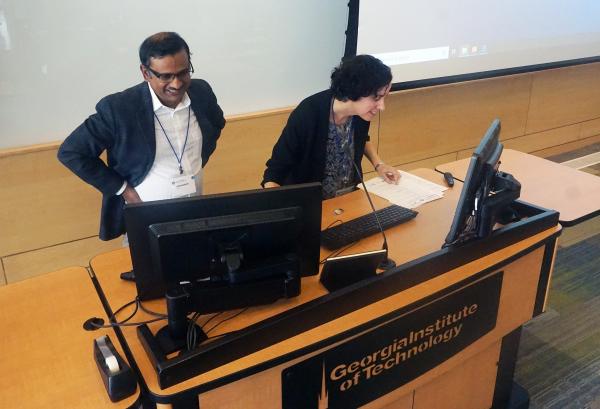 Krish Roy and Johnna Temenoff, director and deputy director of CMaT, respectively, prepare the room for the next session.