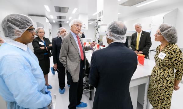 Philanthropist Bernie Marcus makes a point during a tour of the new Good Manufacturing Practice (GMP) like facility that is part of the Marcus Center for Therapeutic Cell Characterization and Manufacturing (MC3M). (Credit: Rob Felt, Georgia Tech)