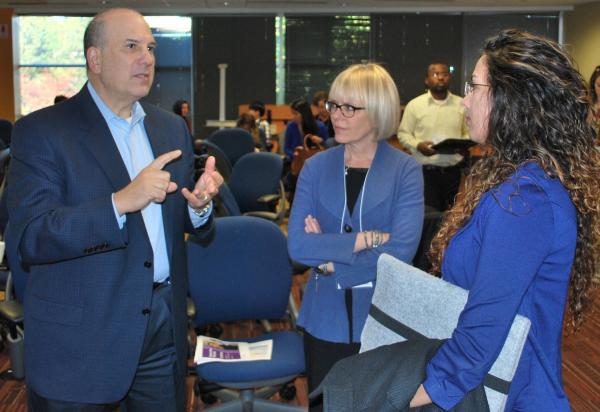 Bruce Lavin of UCB makes his point with Cynthia Sundell (center), director of life science industry collaborations for the Parker H. Petit Institute for Bioengineering and Bioscience, and a student from the Georgia Institute of Technology.