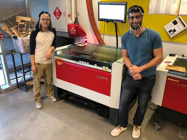 To help meet the need for personal protective equipment (PPE) for health care workers, Georgia Tech has designed and is producing face shields. Shown is a laser cutting machine used to create frames for the shields.