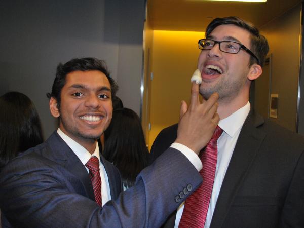 Members of Team Nasaid, Suhaas Anbazhakan (left) and Sudarsan Pranatharthikaran, are having a good time demonstrating their wearable device, which improves infantile nasal aspiration.