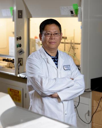 Researchers have developed a technique for producing platinum hollow nanocages with ultra-thin walls that could dramatically reduce the amount of the rare and costly metal needed to provide catalytic activity in such applications as fuel cells. Georgia Tech professor Younan Xia is shown here in his laboratory. (Credit: Rob Felt, Georgia Tech)
