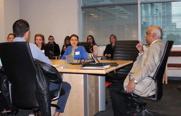 Sathya Gourisankar gathers a new group of BioID recruits around the meeting table.