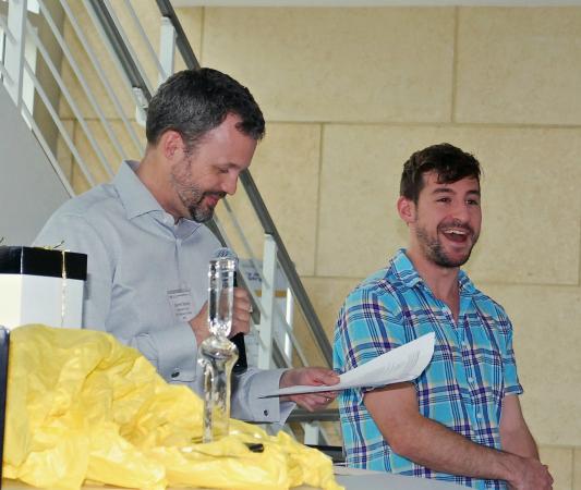 Vince Fiore, who won the award for Outstanding Fundamental Research, reacts to something Garrett Stanley said during the award presentation.