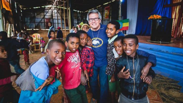 Rudy Gleason in Ethiopia with a group of children.