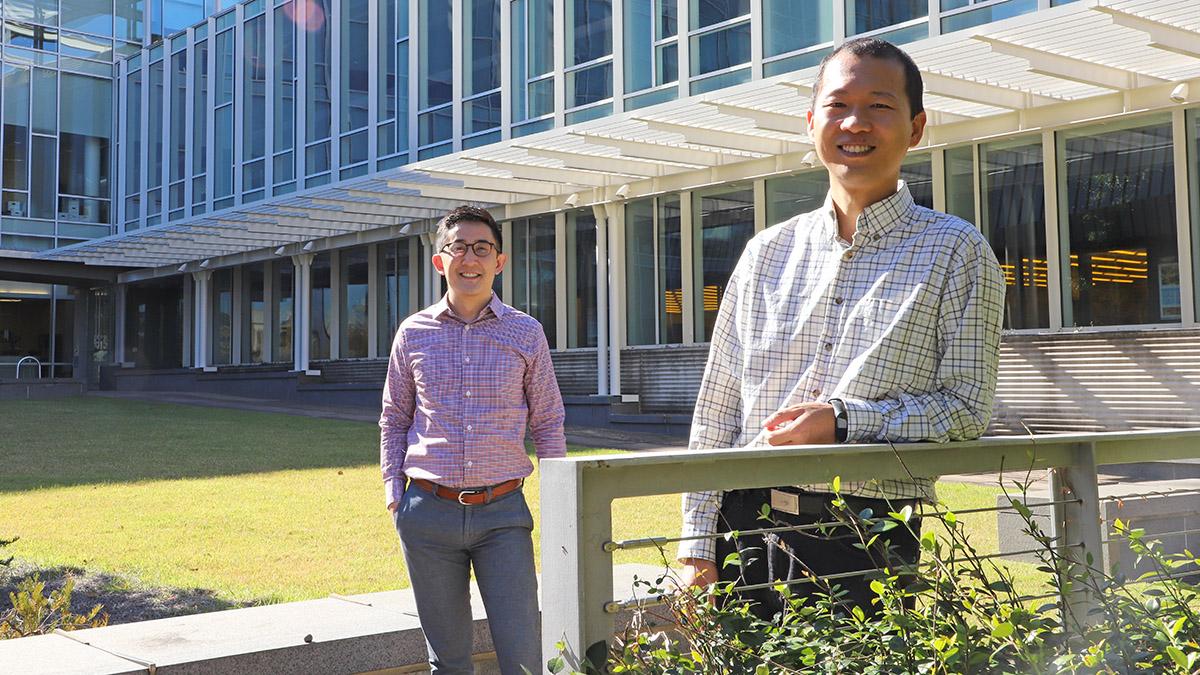 Gabe Kwong, left, and Peng Qiu, who are collaborating on a new project to develop synthetic biosensors capable of basic computing logic. (Photo: Joshua Stewart)