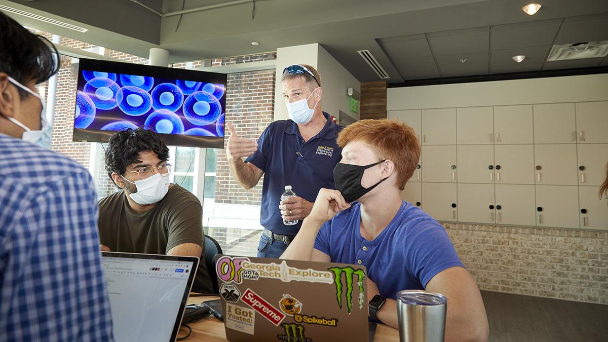 Professor of the Practice James Stubbs talks with students in the Capstone Design course. (Photo: Craig Bromley)