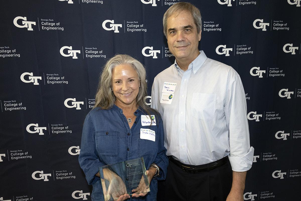 Sandra Maffey accepts her 2022 College of Engineering Staff Innovation & Process Improvement Award from Senior Associate Dean Doug Williams. (Photo: Candler Hobbs)